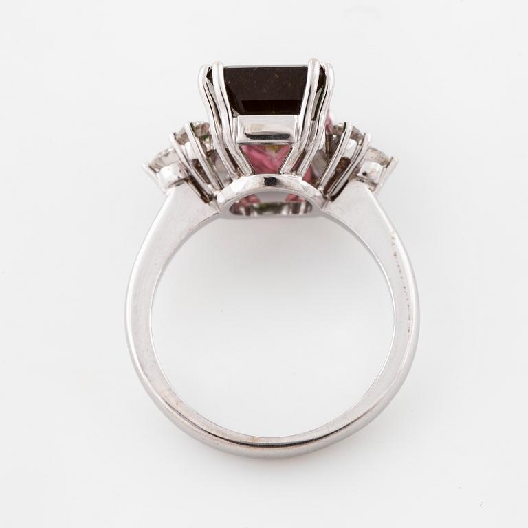 A emerald cut tourmaline and brilliant cut diamond ring.