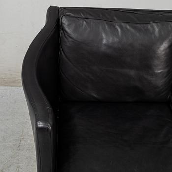 An 'AV59' sofa by Arne Vodder, Nielaus, Denmark.