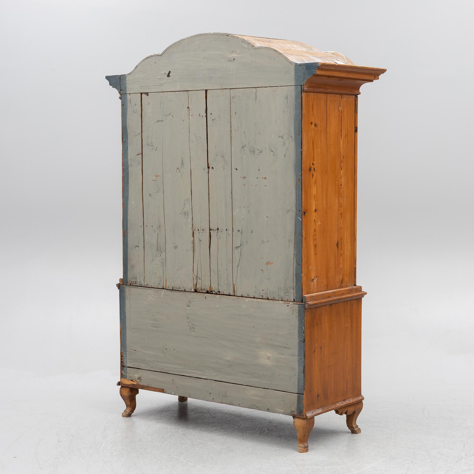 An 18th two-part pine century cabinet.