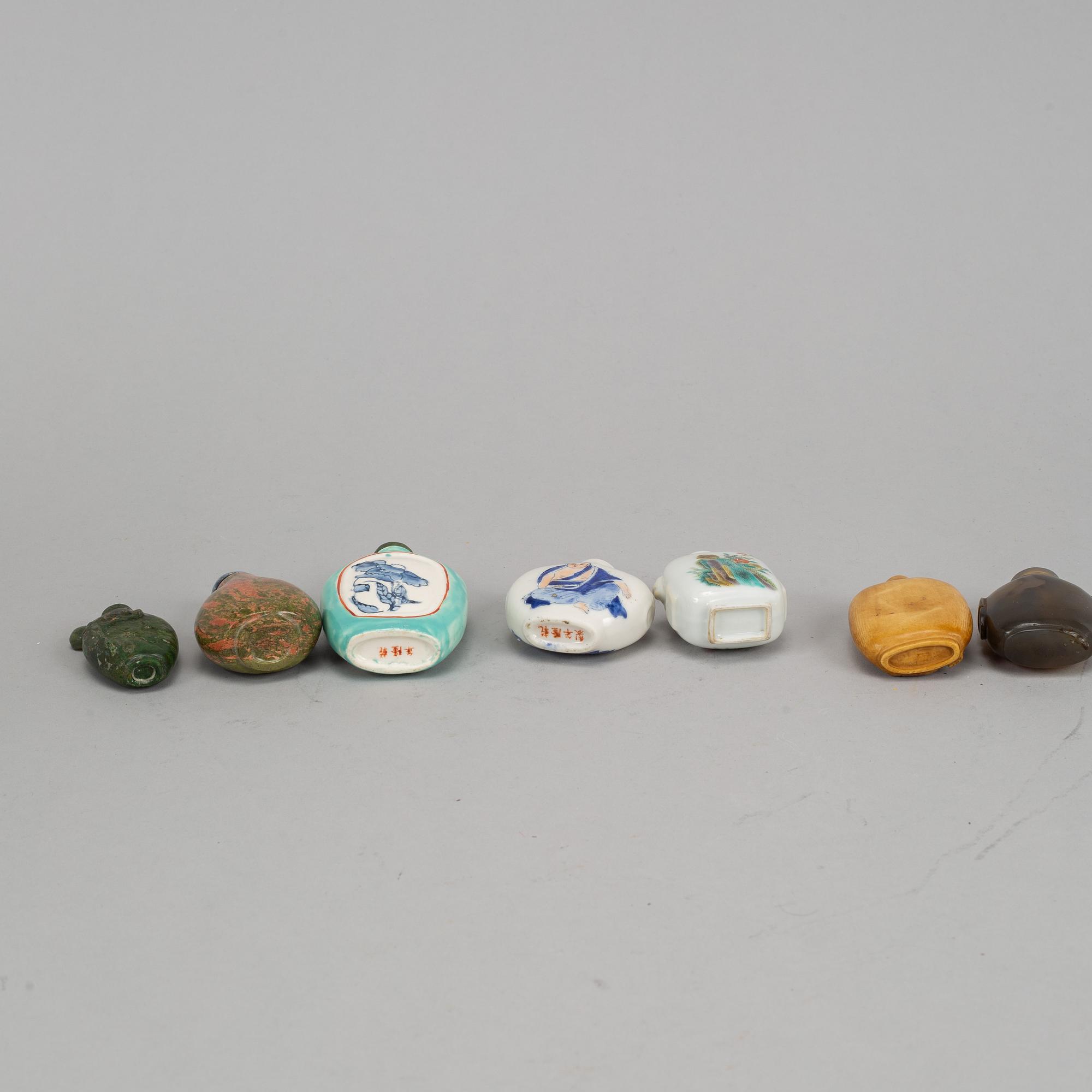 A group of seven stone, ceramic and porcelain snuff bottles, Qing dynasty and China, 19th-20th century.