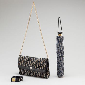 CHRISTIAN DIOR, a set of a clutch, a belt and an umbrella.