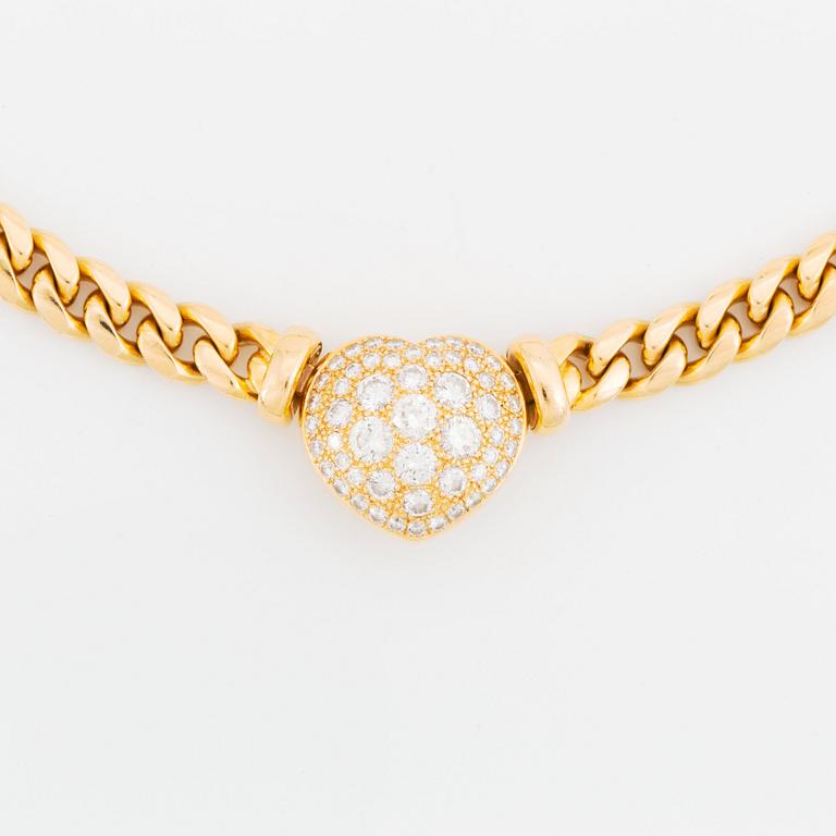 An 18K gold necklace set with round brilliant-cut diamonds.