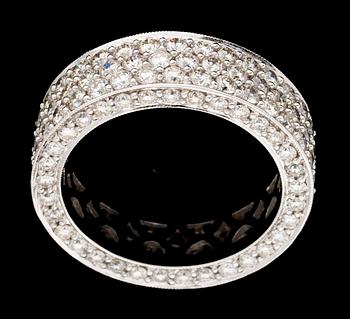 684. A gold and diamond eternity ring.