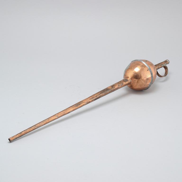 A 19th century pipette in copper.