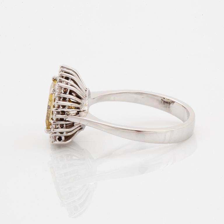 Princess-cut colour treated fancy deep brown-yellow diamond ring.