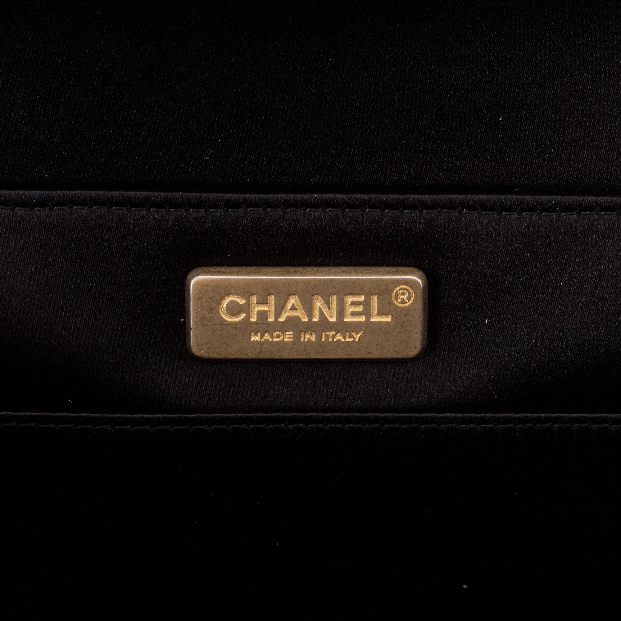 Chanel, a black satin clutch, 2019.