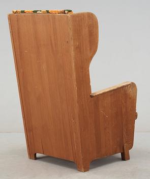 An Axel Einar Hjorth stained pine armchair 'Lovö', Nordiska Kompaniet, Sweden.