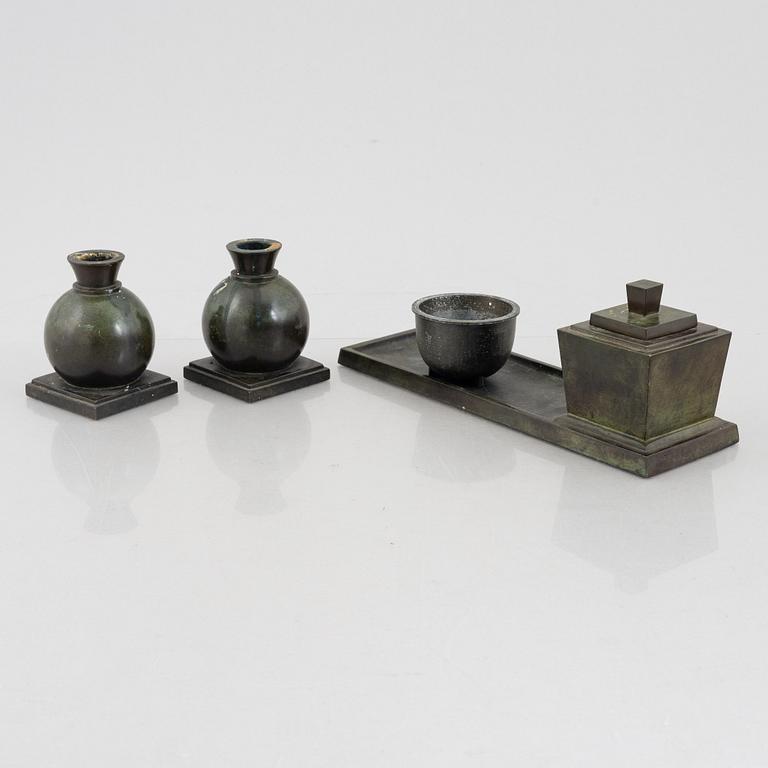 Guldsmedsaktiebolaget, a writing stand and a pair of candle holders, bronze, Sweden, 1920's.