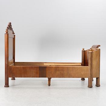 A late Empire bed, mid-19th century.