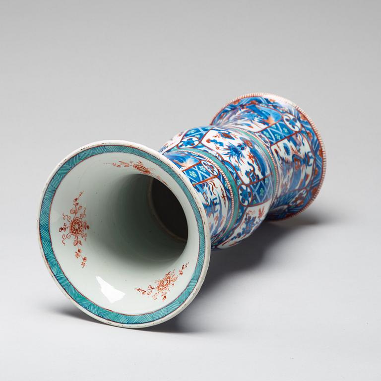 A blue and white 'Clobbered' vase, Qing dynasty, Kangxi (1662-1722).