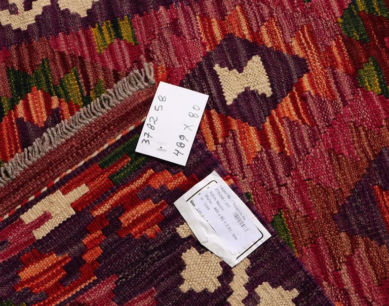 A Kilim runner carpet, c. 489 x 80 cm.