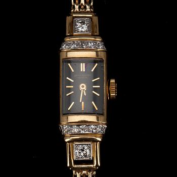 DAMARMBANDSUR, 18k guld samt briljantslipade diamanter tot. ca 0,38 ct. Patek Philippe, Genève.