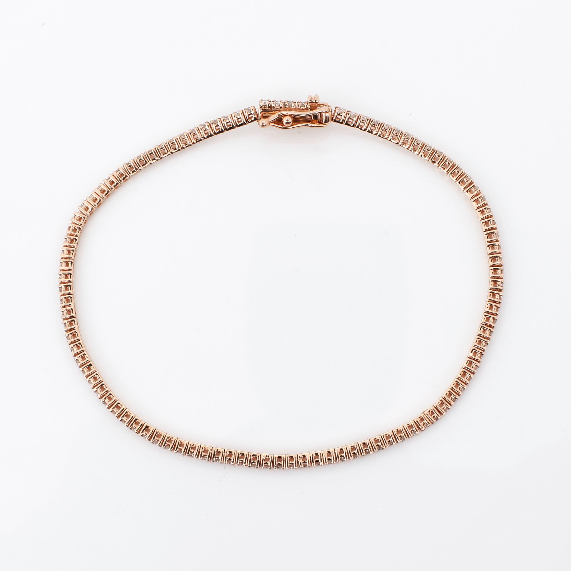 ARMBAND, ett riviére i rosa guld med briljanter, totalt ca 0.99ct.