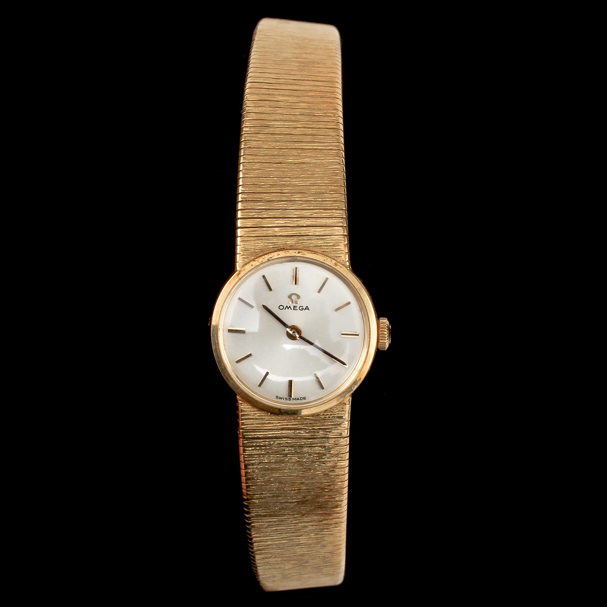 DAMARMBANDSUR, Omega, 18k guld, 1900-talets andra hälft. Vikt 39 g.