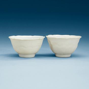 1677. A pair of white glazed bowls, Ming dynasty, with Chenghua six character mark.