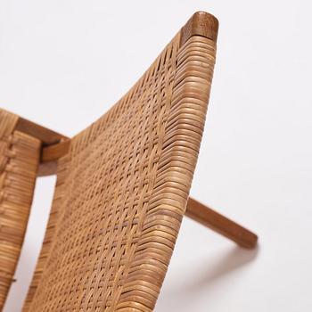 Hans J. Wegner, a pair of oak and rattan folding chairs 'JH-512', Johannes Hansen, Denmark 1950-60s.