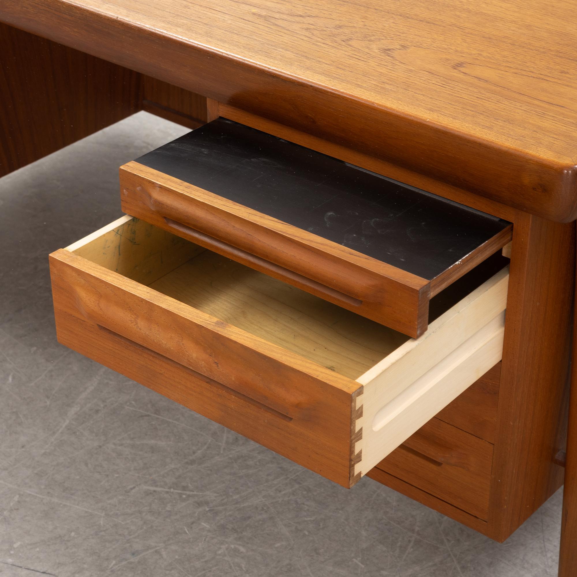 A teak 1950's/60's writing desk.