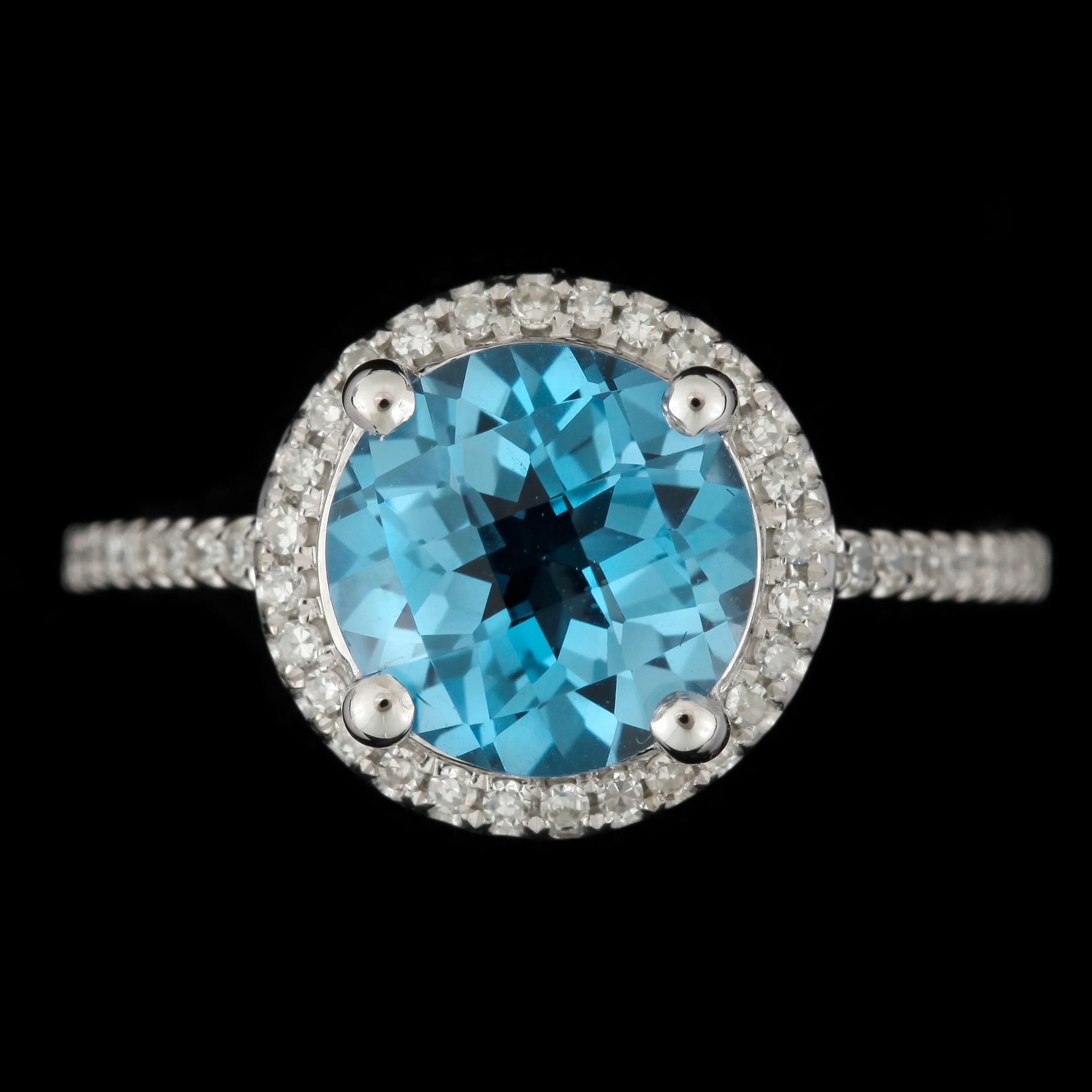 RING, 14k vitguld med blå topas ca2,7ct och diamanter tot ca0,23ct. Vikt 3g.