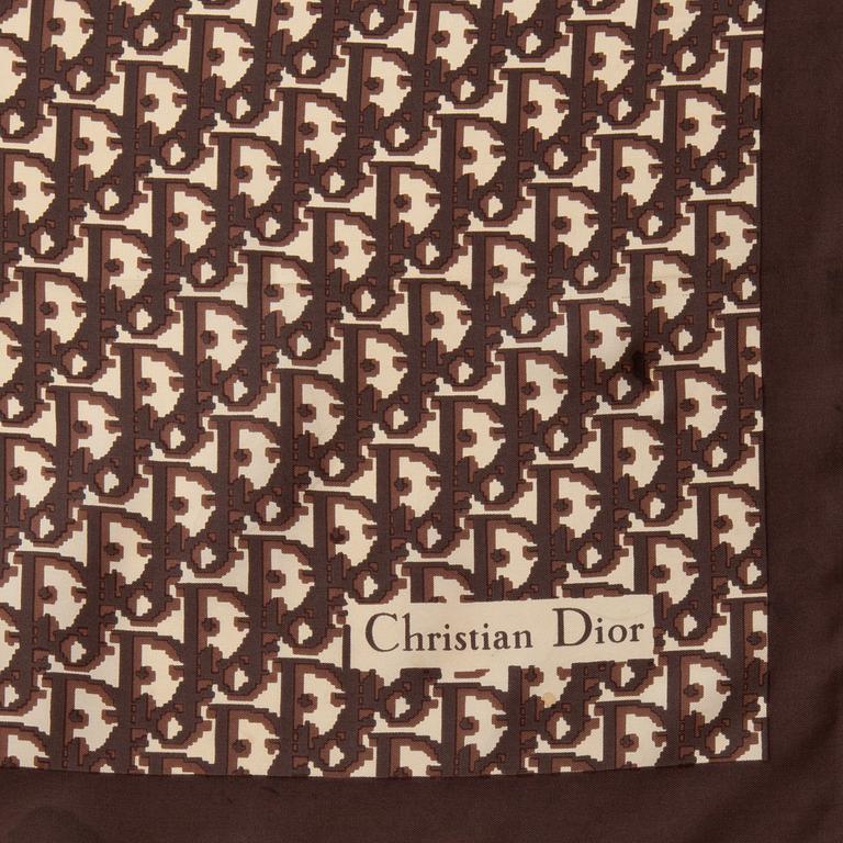 CHRISTIAN DIOR, a brown monogrammed silk scarf.
