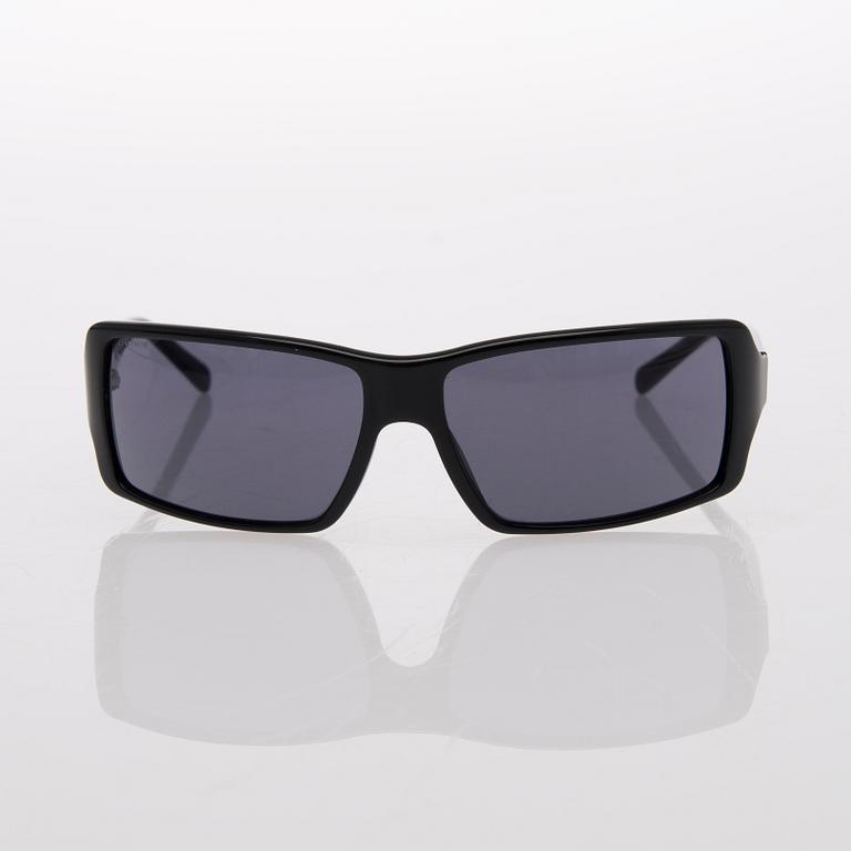 Two Pairs of Sunglasses, Prada and Chanel.