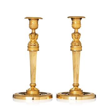 A pair of French Empire candlesticks, early 19th century.