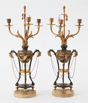 A pair of  Louis XVI-style late 19th century three-light candelabra.