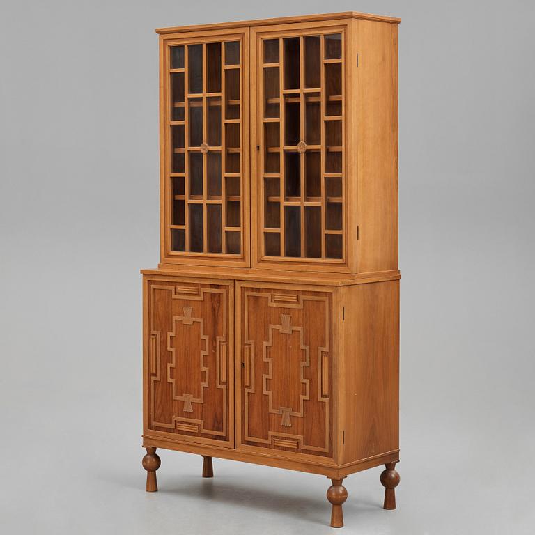 A Swedish Grace mahogany showcase cabinet, reportedly a win at the Stockholm Cabinetmaker's association lottery, 1920's.