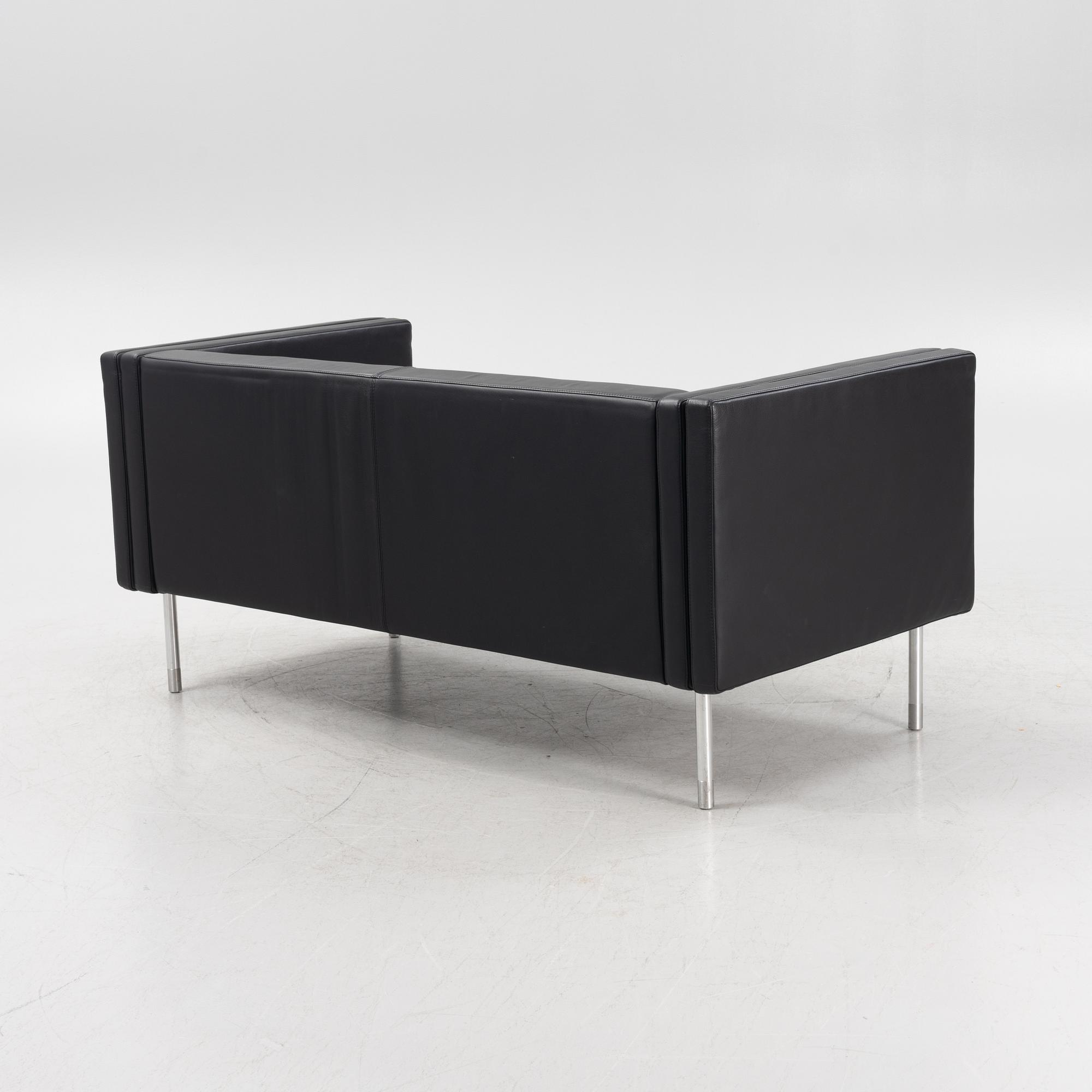 A leather upholstered sofa, 21st Century.
