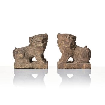 A pair of stone sculptures of buddhist lions, Qing dynasty (1664-1912).