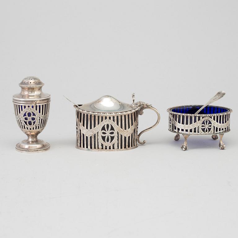 A mustard pot, a pepper pot, a salt cellar, silver, London, England, early 20th century. Weigth ca 412 grams.