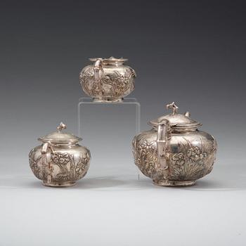 A three piece export silver tea service, Shanghai, early 20th Century.