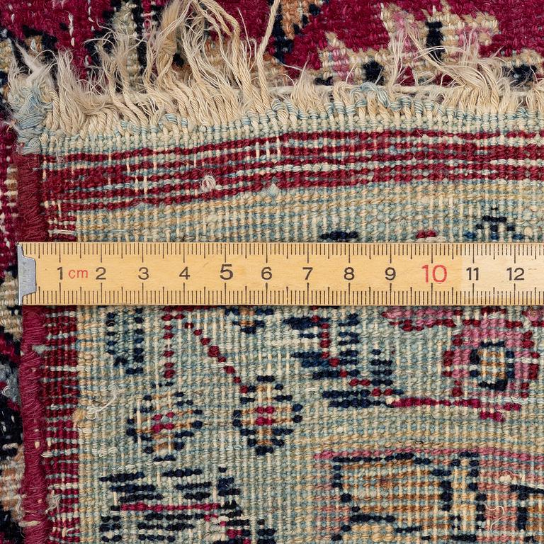 A semi-antique Kirman carpet, South Persia, c. 380 x 289 cm.