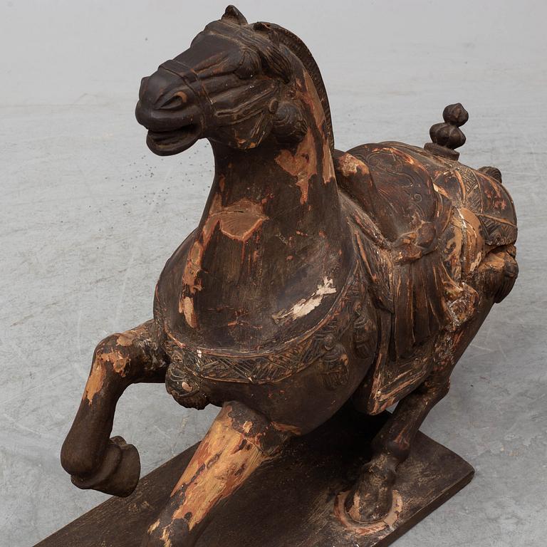 Two large wooden sculptures of horses, 20th century.
