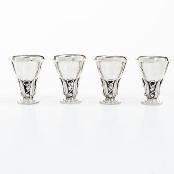 Evald Nielsen, four sterling silver beakers/cups on a foot, Denmark 20th century.