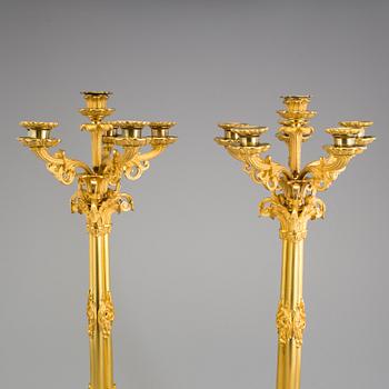 A pair of mid 19th century Empire gilt bronze candelabras.