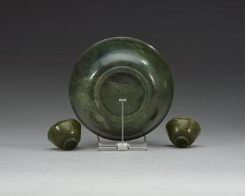 A Chinese green stone bowl and two winecups.