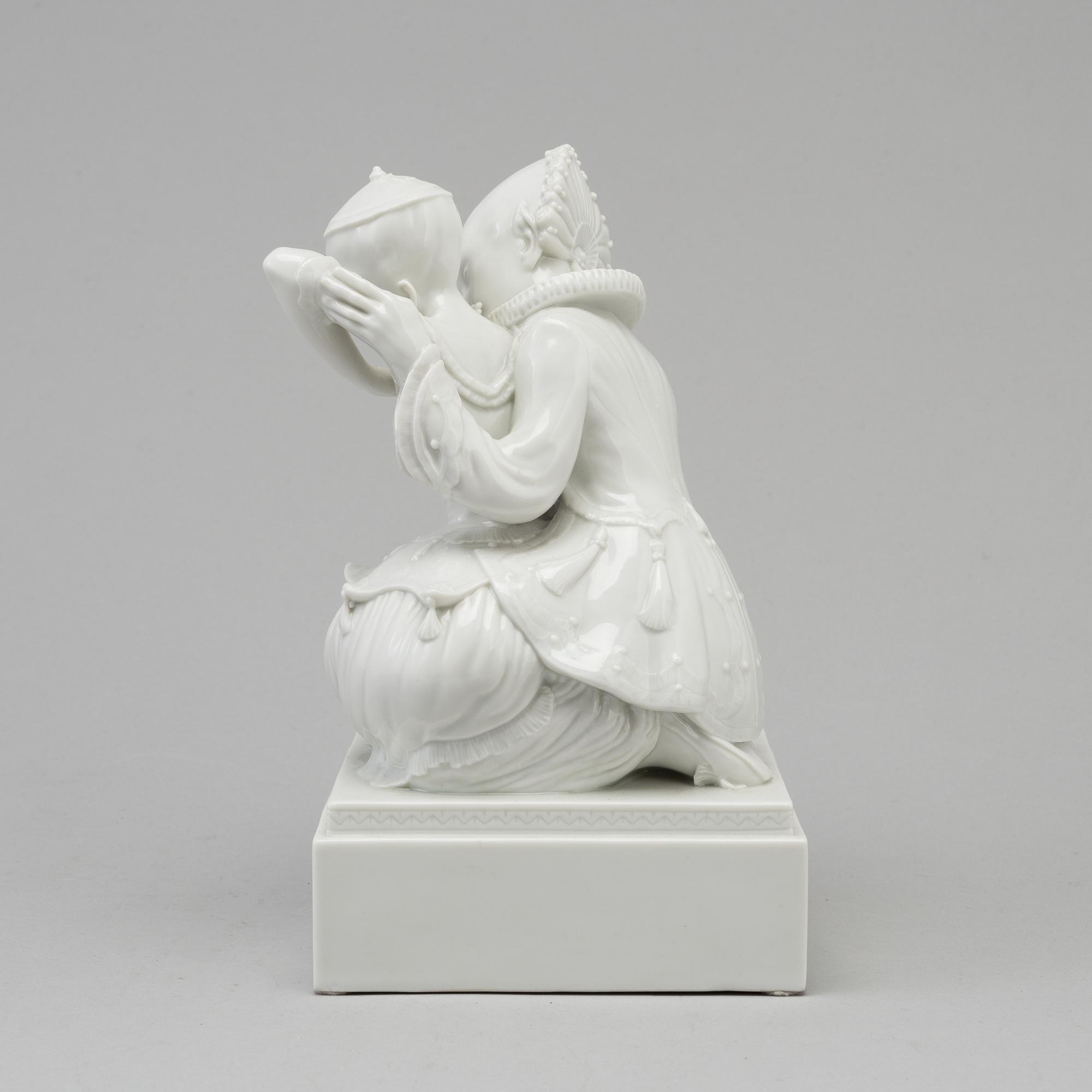 A white glazed Royal Copenhagen porcelain figure, Gerhard Henning, Danmark, 1920's.
