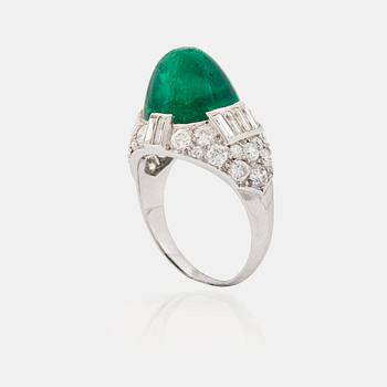 895. A cabochon-cut emerald, baguette, single and brilliant-cut diamond ring.