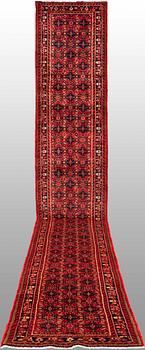 A Hosseinabad runner, c. 605 x 84 cm.