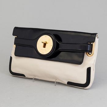 A black and white leather clutch by Balenciaga.