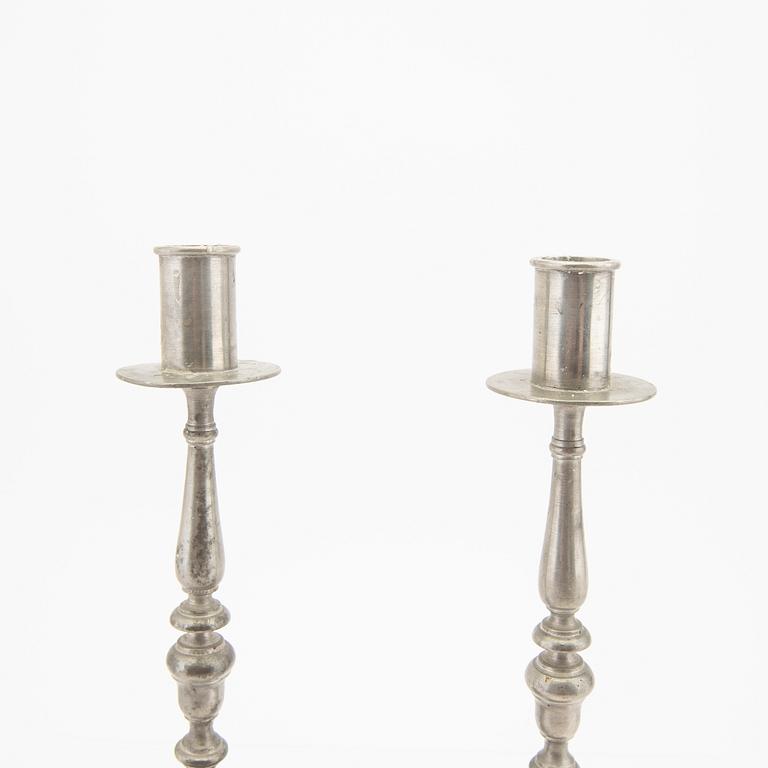 Firma Svenskt Tenn,  a pair of 1928 pewter candle sticks.