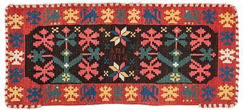 A carrige cushion, ”Stiliserade Ekar”, flat weave, ca 119 × 52 cm, signed AMS, dated 1814.