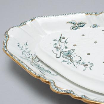 A earthenware table set of 136 pcs "Vexiö Guld",  by Arvid Ekberg, Gustafsberg, from around year 1900.