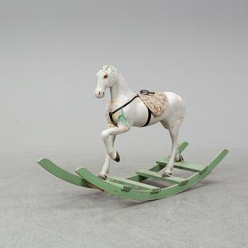 A wooden rocking horse from the early 20th century.