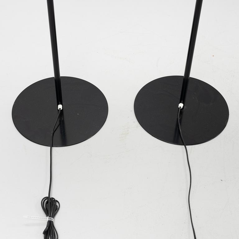 A pair of black metal floorlights, Luxus, Vittsjö.