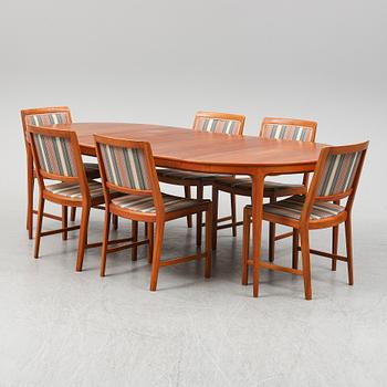 BERTIL FRIDHAGEN, a seven  piece walnut dining suite from Bodafors.