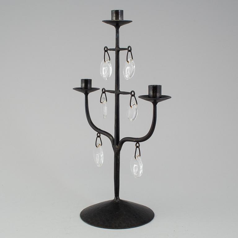 A wrought iron and glass candelabra by Erik Höglund.