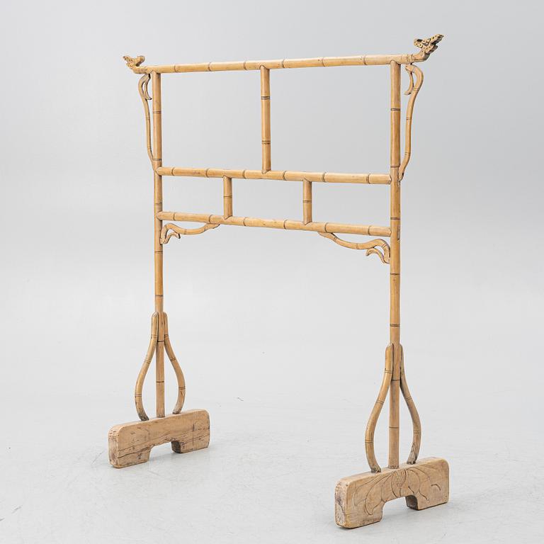 A Chinese bamboo and hardwood clothes rack, 20th century.