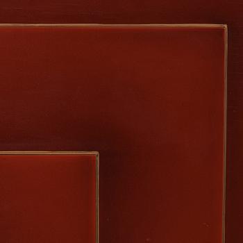 A red lacquered cabinet with carved and bronzed decoration 'à la chinoise', by Otto Wretling, Umeå, Sweden 1930's.