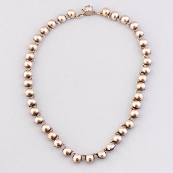 A  RIVIERE NECKLACE, facetted glass, silver, 19th century.
